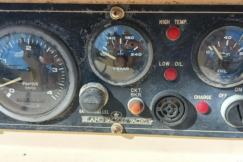 Ivory Star Yacht Photos Pics Instrument panel of a 1999 Island Packet 350 yacht, showing RPM, temperature, and oil gauges.