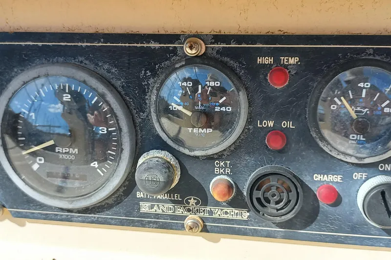 Ivory Star Yacht Photos Pics Instrument panel of a 1999 Island Packet 350 yacht, showing RPM, temperature, and oil gauges.