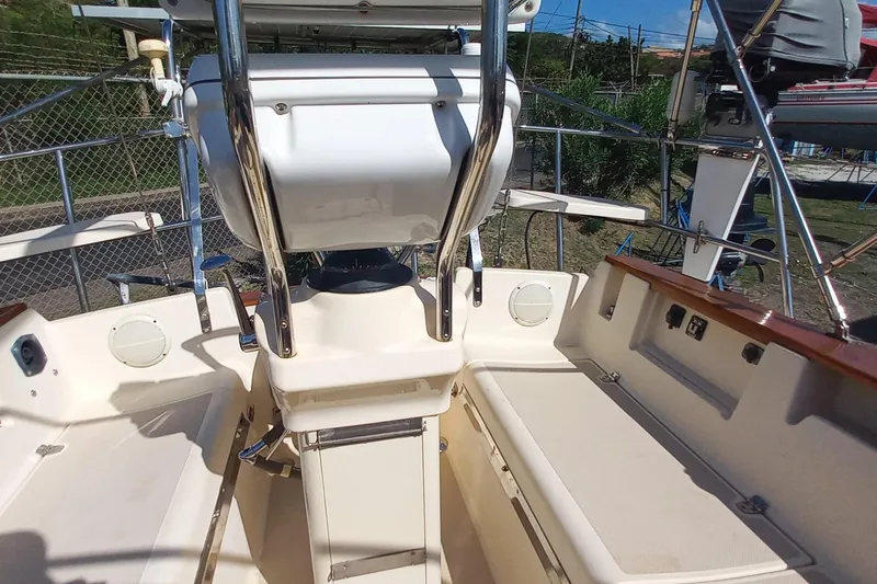 Ivory Star Yacht Photos Pics 1999 Island Packet 350 sailboat cockpit with seating and steering wheel.