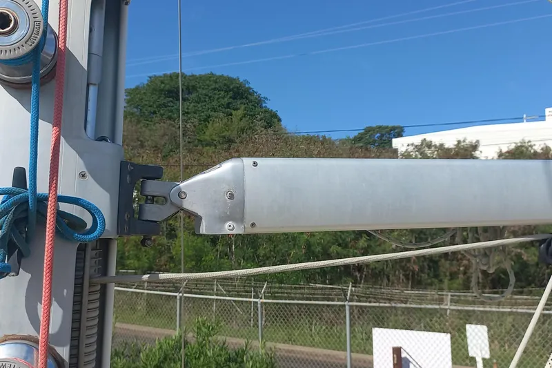 Ivory Star Yacht Photos Pics Close-up of a 1999 Island Packet 350 sailboat mast and rigging against a clear blue sky.