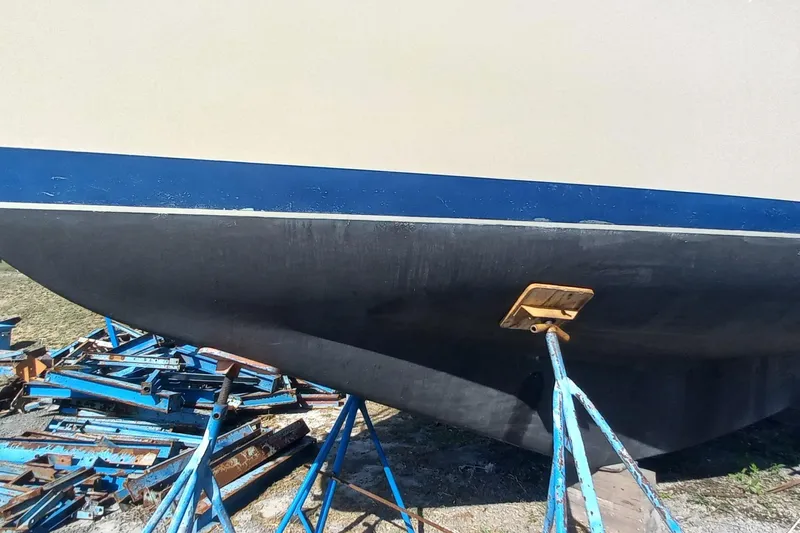 Ivory Star Yacht Photos Pics 1999 Island Packet 350 sailboat hull on stands, ready for maintenance.