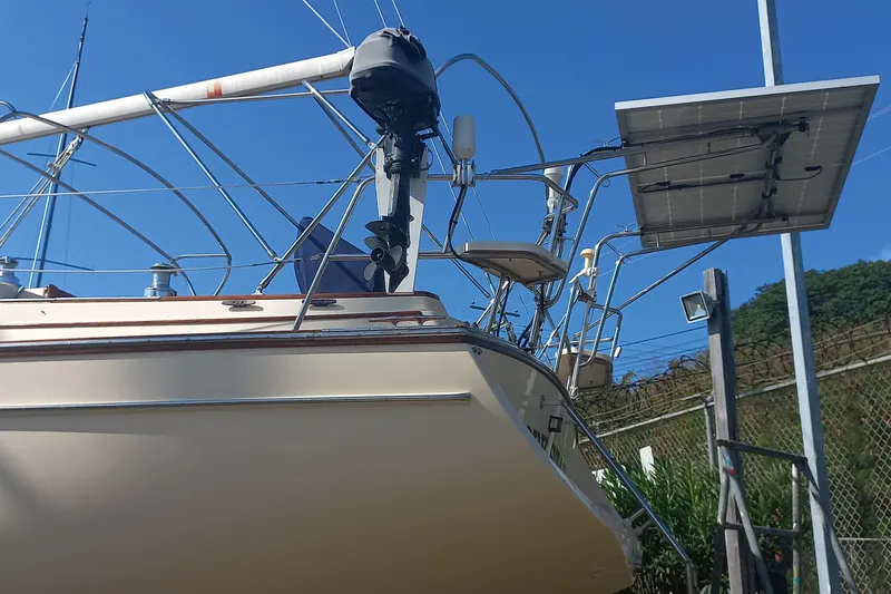 Ivory Star Yacht Photos Pics 1999 Island Packet 350 sailboat with solar panel and rigging against blue sky.