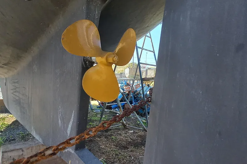 Ivory Star Yacht Photos Pics Yellow propeller of 1999 Island Packet 350 sailboat on dry dock.