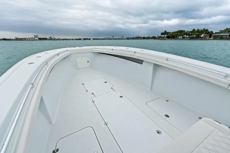  Yacht Photos Pics 2021 Yellowfin 36 Offshore boat deck with ocean view and cloudy sky.