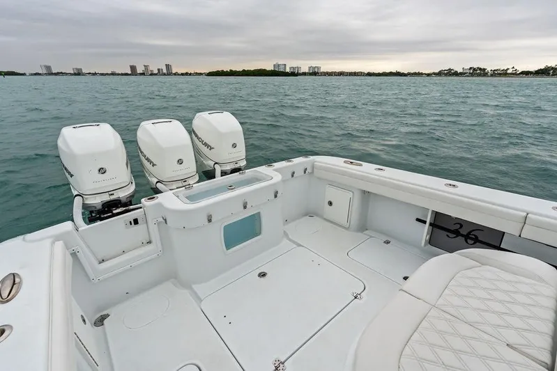  Yacht Photos Pics 2021 Yellowfin 36 Offshore boat with triple Mercury engines on open water.