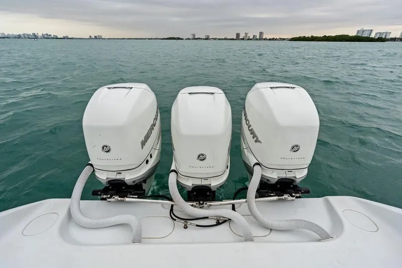  Yacht Photos Pics Triple Mercury outboard engines on 2021 Yellowfin 36 Offshore boat in open water.