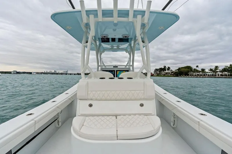  Yacht Photos Pics 2021 Yellowfin 36 Offshore boat on water, featuring sleek design and spacious seating.