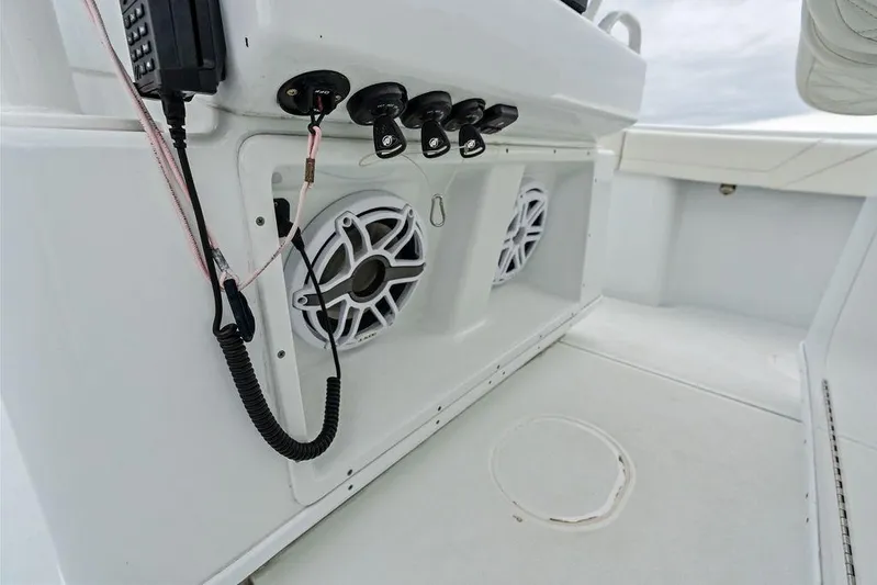  Yacht Photos Pics 2021 Yellowfin 36 Offshore boat interior with speakers and control panel.