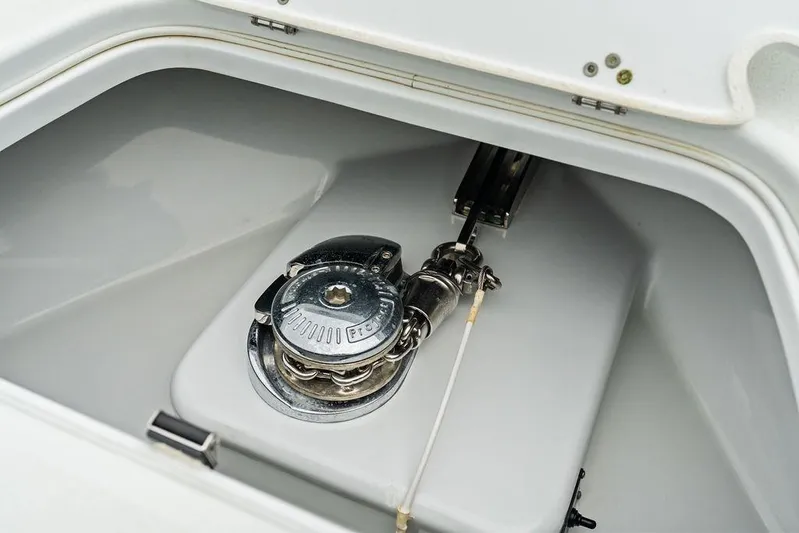  Yacht Photos Pics Anchor locker of 2021 Yellowfin 36 Offshore boat, featuring a polished winch system.