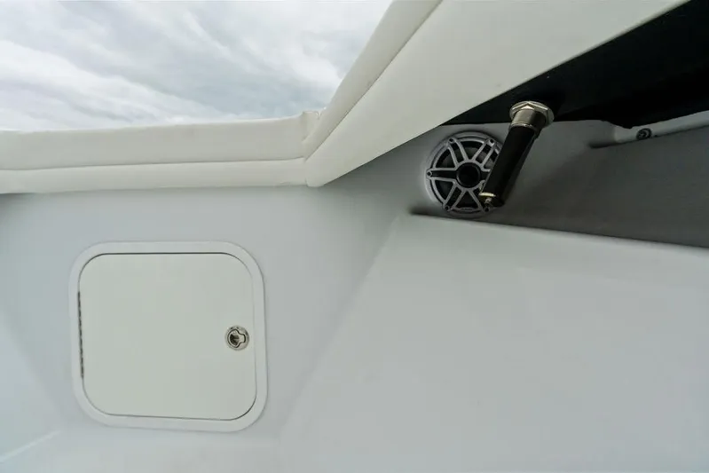  Yacht Photos Pics 2021 Yellowfin 36 Offshore boat interior with speaker and storage compartment.