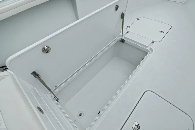  Yacht Photos Pics 2021 Yellowfin 36 Offshore boat storage compartment, open lid, spacious interior.