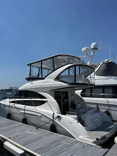  Yacht Photos Pics 2008 Meridian 391 Sedan yacht docked at marina under clear blue sky.