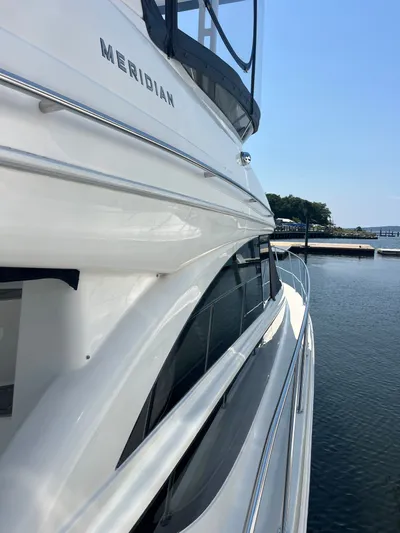  Yacht Photos Pics 2008 Meridian 391 Sedan yacht docked by the water on a sunny day.