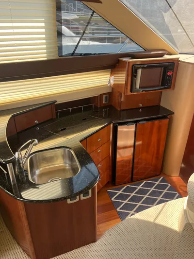  Yacht Photos Pics Luxurious 2008 Meridian 391 Sedan yacht kitchen with modern appliances and sleek design.