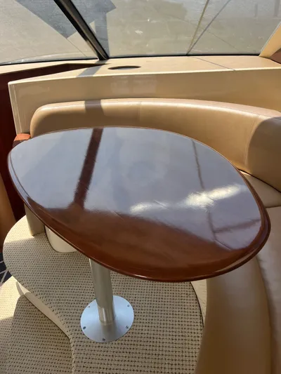  Yacht Photos Pics Luxurious interior of 2008 Meridian 391 Sedan with polished wooden table and leather seating.