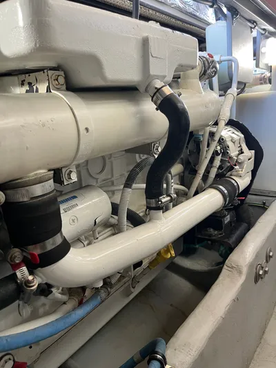  Yacht Photos Pics Engine compartment of a 2008 Meridian 391 Sedan, showcasing pipes and mechanical components.