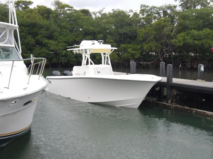 Seavee Yacht Photos Pics 2025 SeaVee 320Z boat docked near lush mangroves.