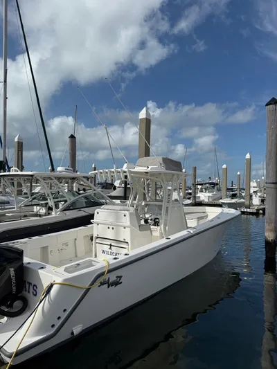 Seavee Yacht Photos Pics 2025 SeaVee 320Z boat docked at marina under blue sky.