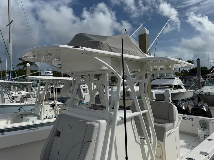 Seavee Yacht Photos Pics 2025 SeaVee 320Z boat docked at marina under cloudy sky.