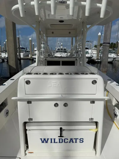 Seavee Yacht Photos Pics 2025 SeaVee 320Z boat at marina, featuring "WILDCATS" cooler.
