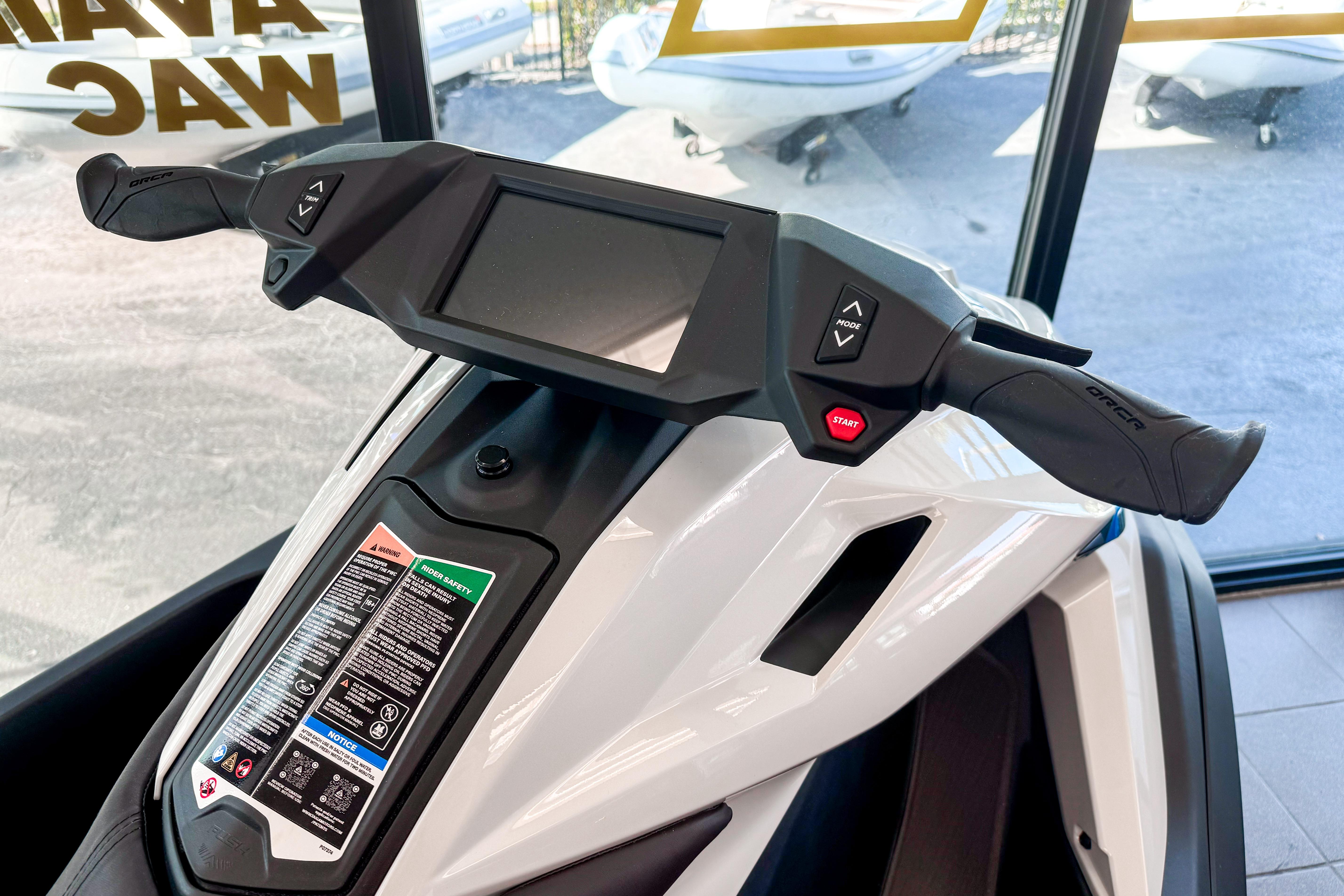 2025 Taiga Orca P2 dashboard with digital display and control buttons.