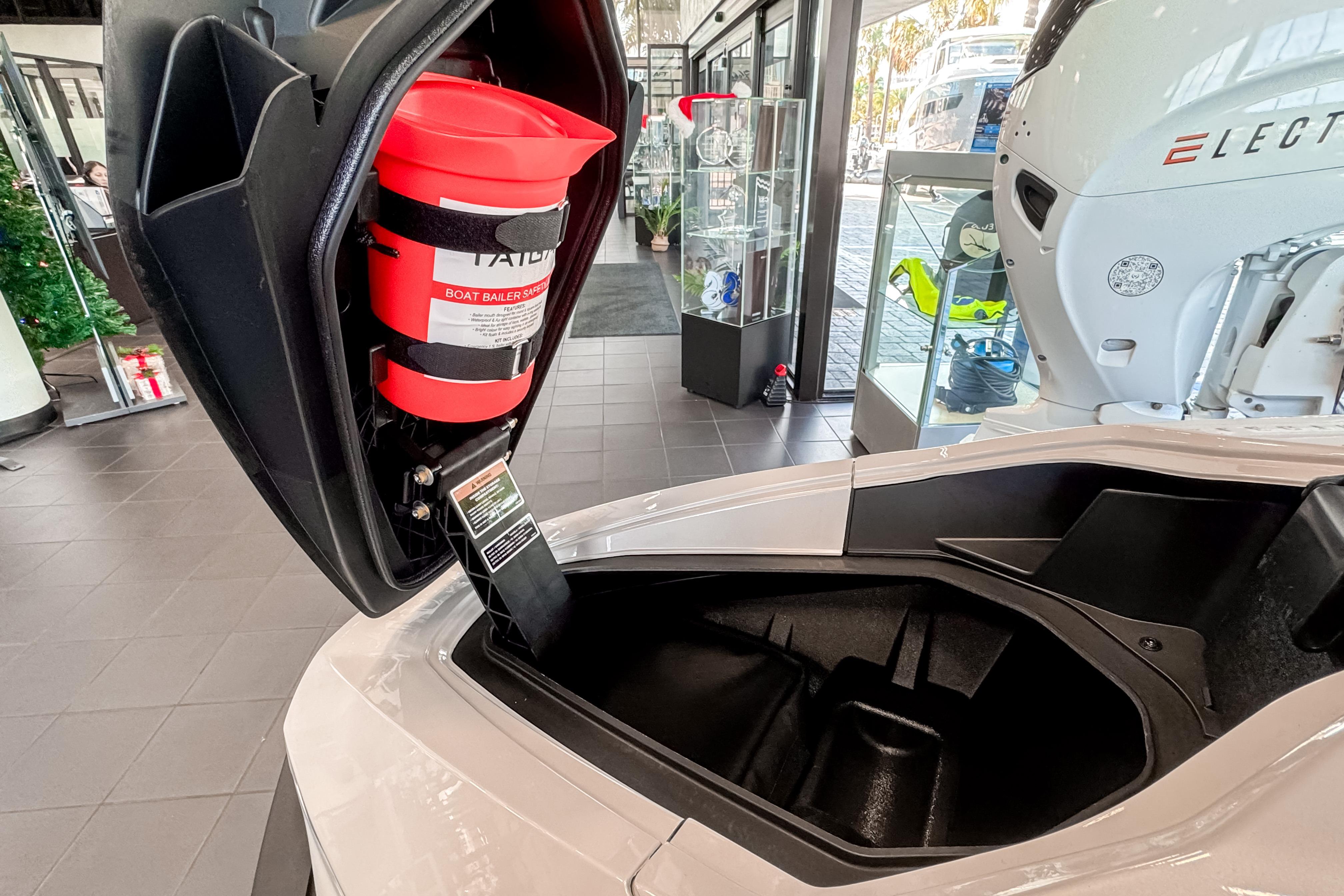 2025 Taiga Orca P2 electric watercraft with open storage compartment and safety equipment.