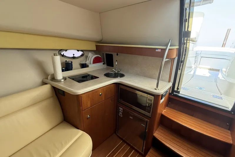  Yacht Photos Pics 2008 Tiara Yachts 3000 Open interior with kitchenette and seating area.