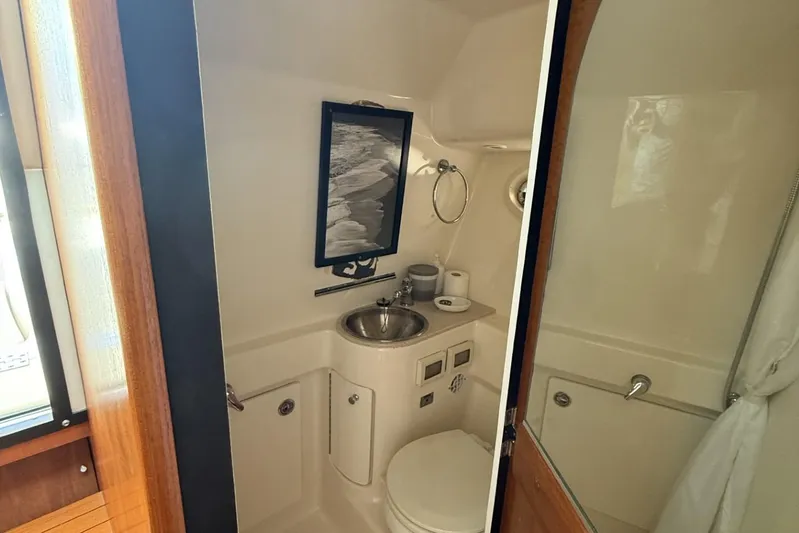  Yacht Photos Pics 2008 Tiara Yachts 3000 Open bathroom with sink, toilet, and mirror.