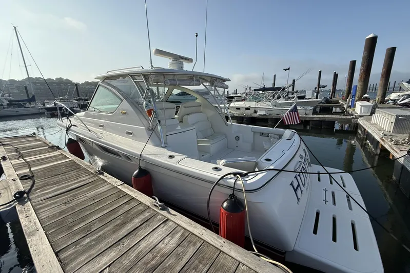  Yacht Photos Pics 2008 Tiara Yachts 3000 Open docked at marina, featuring sleek design and American flag.