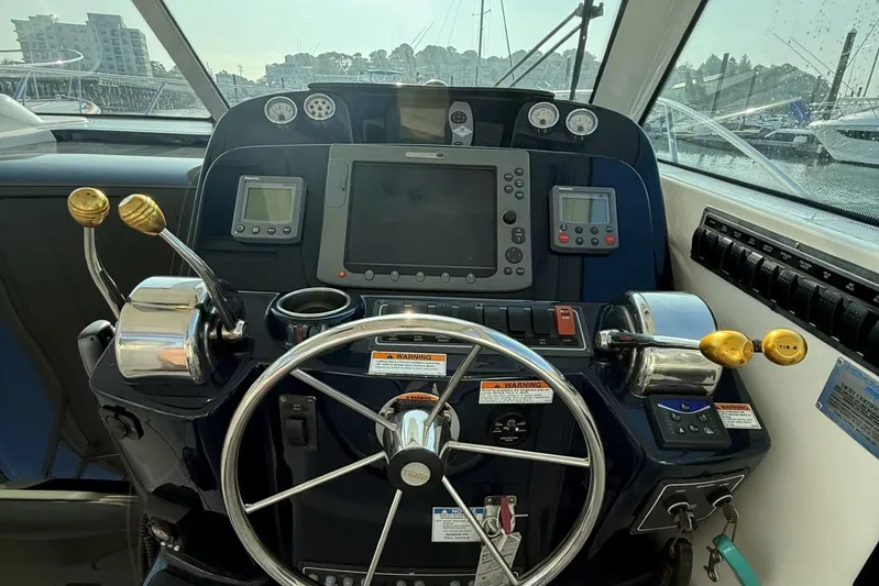  Yacht Photos Pics 2008 Tiara Yachts 3000 Open helm with steering wheel and navigation controls.