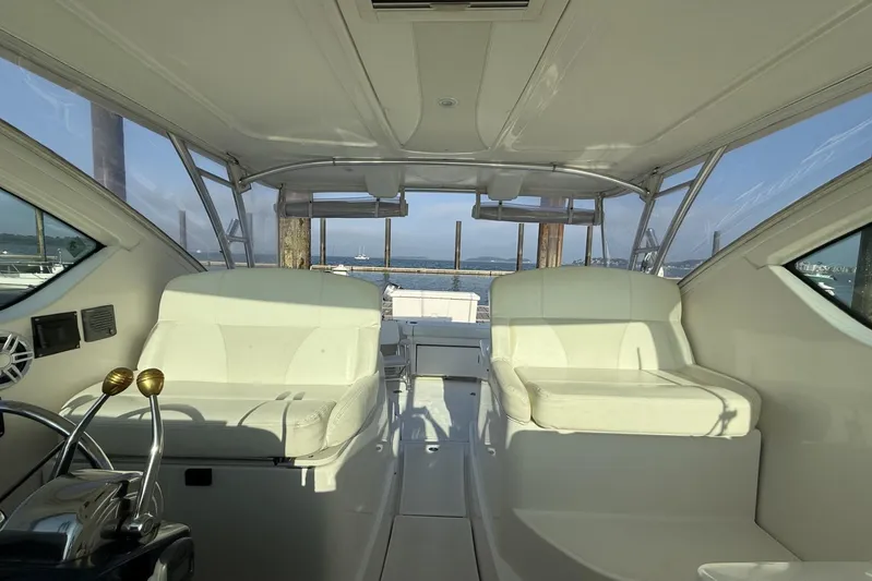  Yacht Photos Pics 2008 Tiara Yachts 3000 Open interior with white seating and ocean view.
