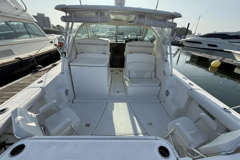  Yacht Photos Pics 2008 Tiara Yachts 3000 Open boat interior at marina, showcasing seating and helm area.