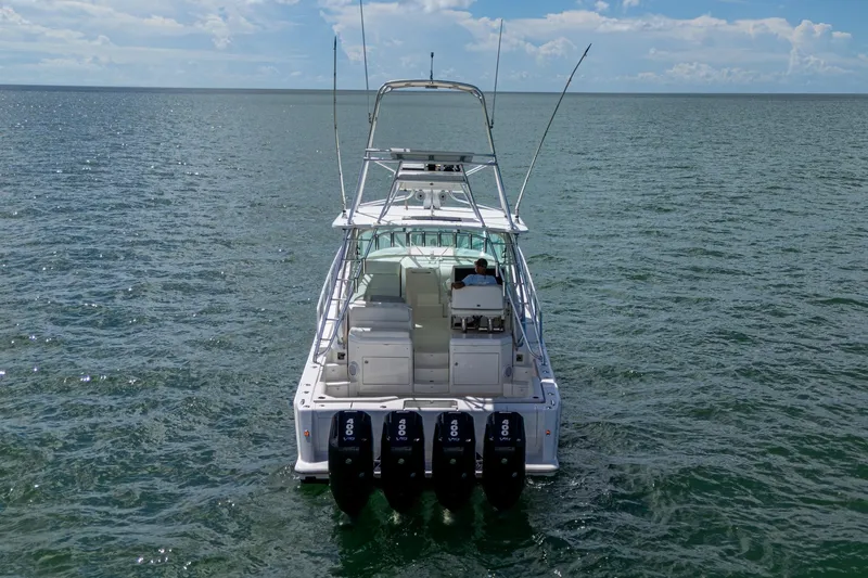 Absent Minded Yacht Photos Pics 2014 SeaVee 430 boat with four engines cruising on open water.