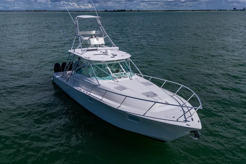 Absent Minded Yacht Photos Pics 2014 SeaVee 430 boat on open water, featuring sleek design and spacious deck.