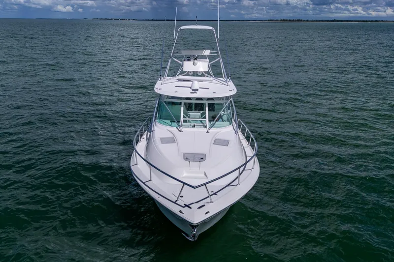 Absent Minded Yacht Photos Pics 2014 SeaVee 430 boat on open water under cloudy sky.