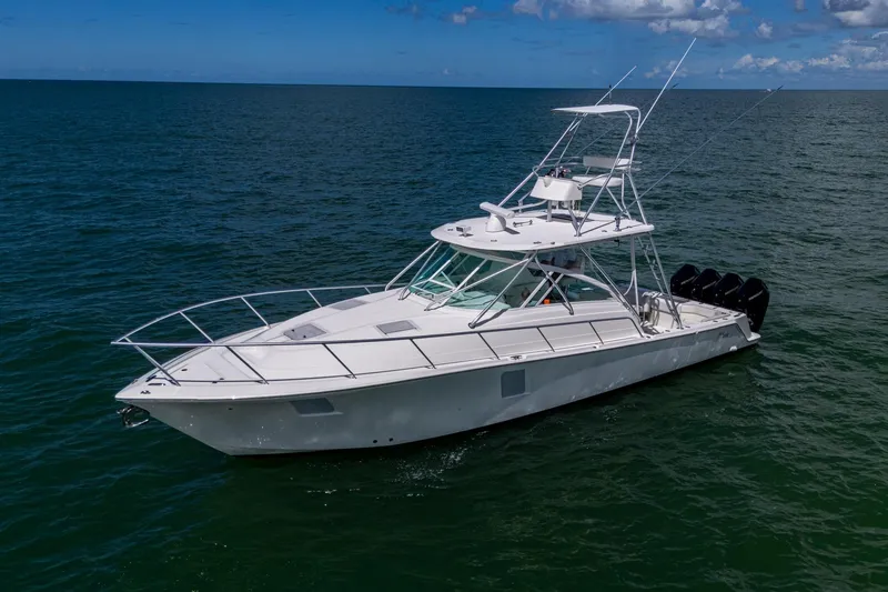 Absent Minded Yacht Photos Pics 2014 SeaVee 430 boat cruising on open water under a clear blue sky.