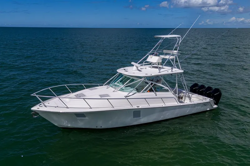 Absent Minded Yacht Photos Pics 2014 SeaVee 430 boat on open water, featuring multiple outboard engines.