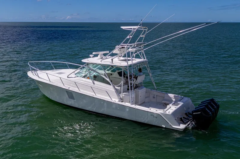 Absent Minded Yacht Photos Pics 2014 SeaVee 430 boat on open water, featuring multiple outboard engines.