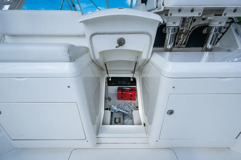Absent Minded Yacht Photos Pics 2014 SeaVee 430 boat storage compartment with equipment and seating.