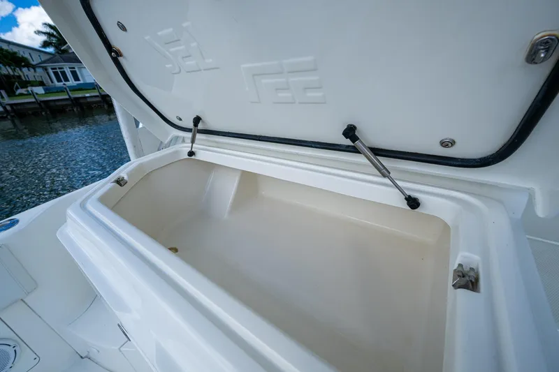 Absent Minded Yacht Photos Pics Open storage compartment on 2014 SeaVee 430 boat, showcasing spacious interior design.