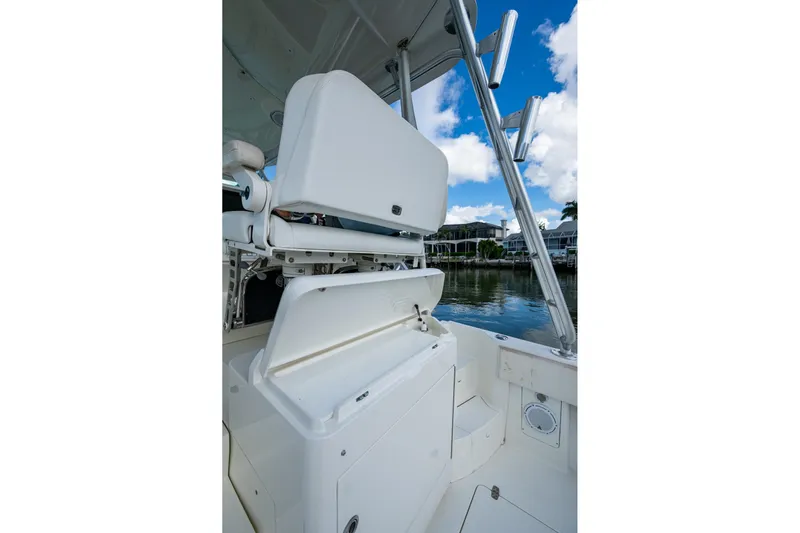 Absent Minded Yacht Photos Pics 2014 SeaVee 430 boat interior with open storage compartments and rod holders.