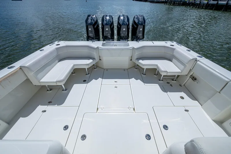 Absent Minded Yacht Photos Pics 2014 SeaVee 430 boat deck with seating and four outboard engines.