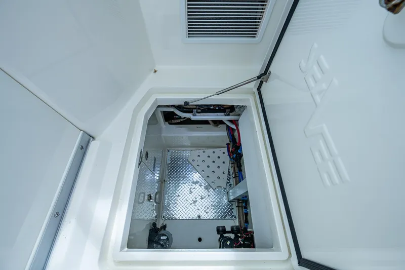 Absent Minded Yacht Photos Pics 2014 SeaVee 430 boat interior compartment with open hatch and visible wiring.