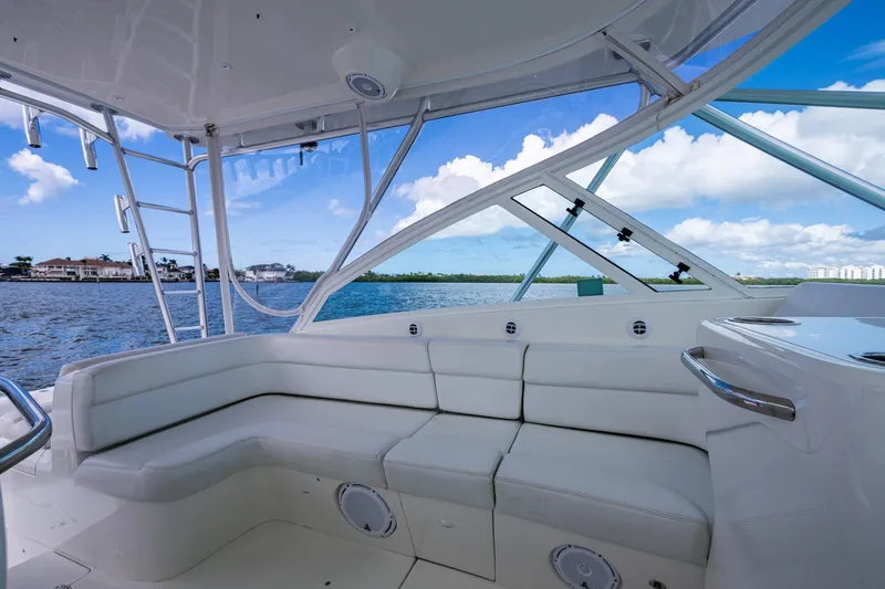 Absent Minded Yacht Photos Pics Luxurious 2014 SeaVee 430 boat interior with white seating and ocean view.