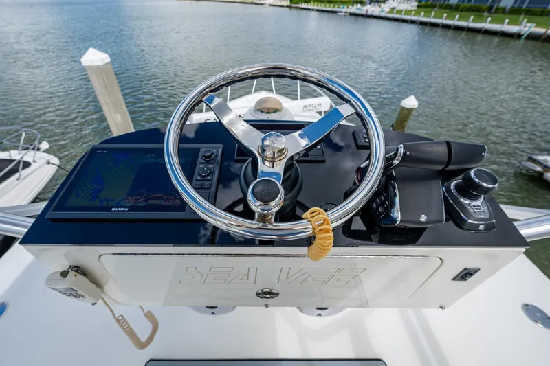 Absent Minded Yacht Photos Pics Steering console of 2014 SeaVee 430 boat with Garmin navigation system.