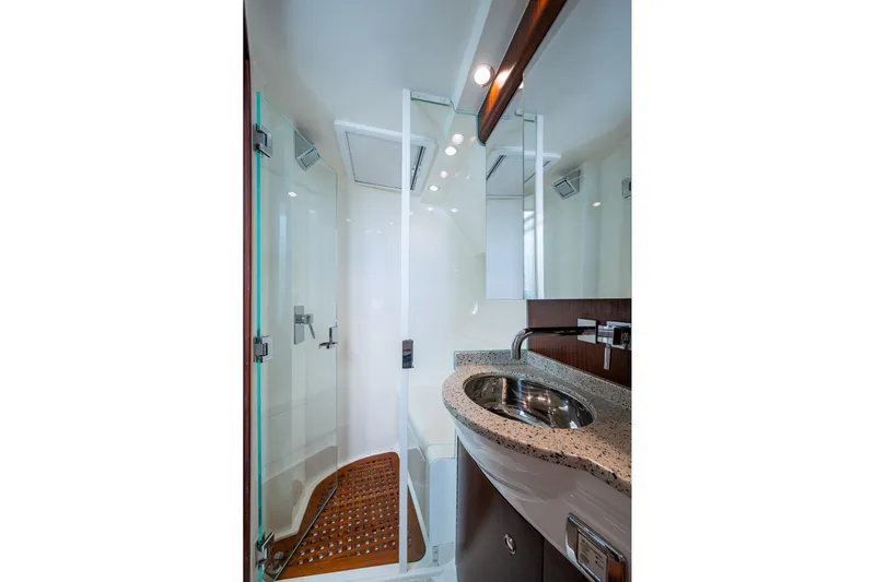 Absent Minded Yacht Photos Pics Luxurious bathroom in 2014 SeaVee 430 yacht with modern fixtures and glass shower.