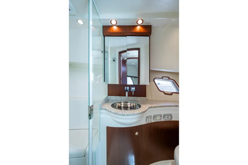 Absent Minded Yacht Photos Pics Luxurious bathroom interior of 2014 SeaVee 430 yacht with modern fixtures and elegant design.