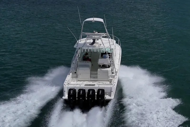 Absent Minded Yacht Photos Pics 2014 SeaVee 430 boat cruising on open water with powerful engines.