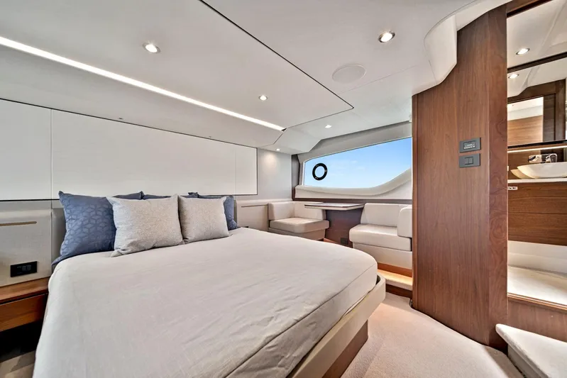 Mine Escape Yacht Photos Pics Luxurious bedroom interior of 2020 Princess F55 Flybridge yacht with modern design and ocean view.