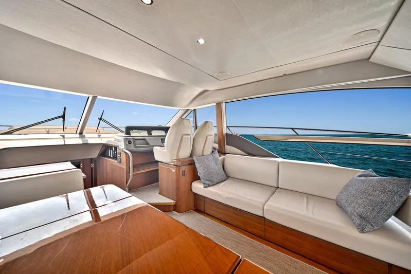 Mine Escape Yacht Photos Pics Luxurious interior of 2020 Princess F55 Flybridge yacht with ocean view.